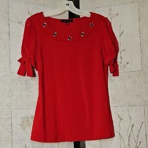Bright Red Blouse with Embellished Neckline and Ruffled Sleeves